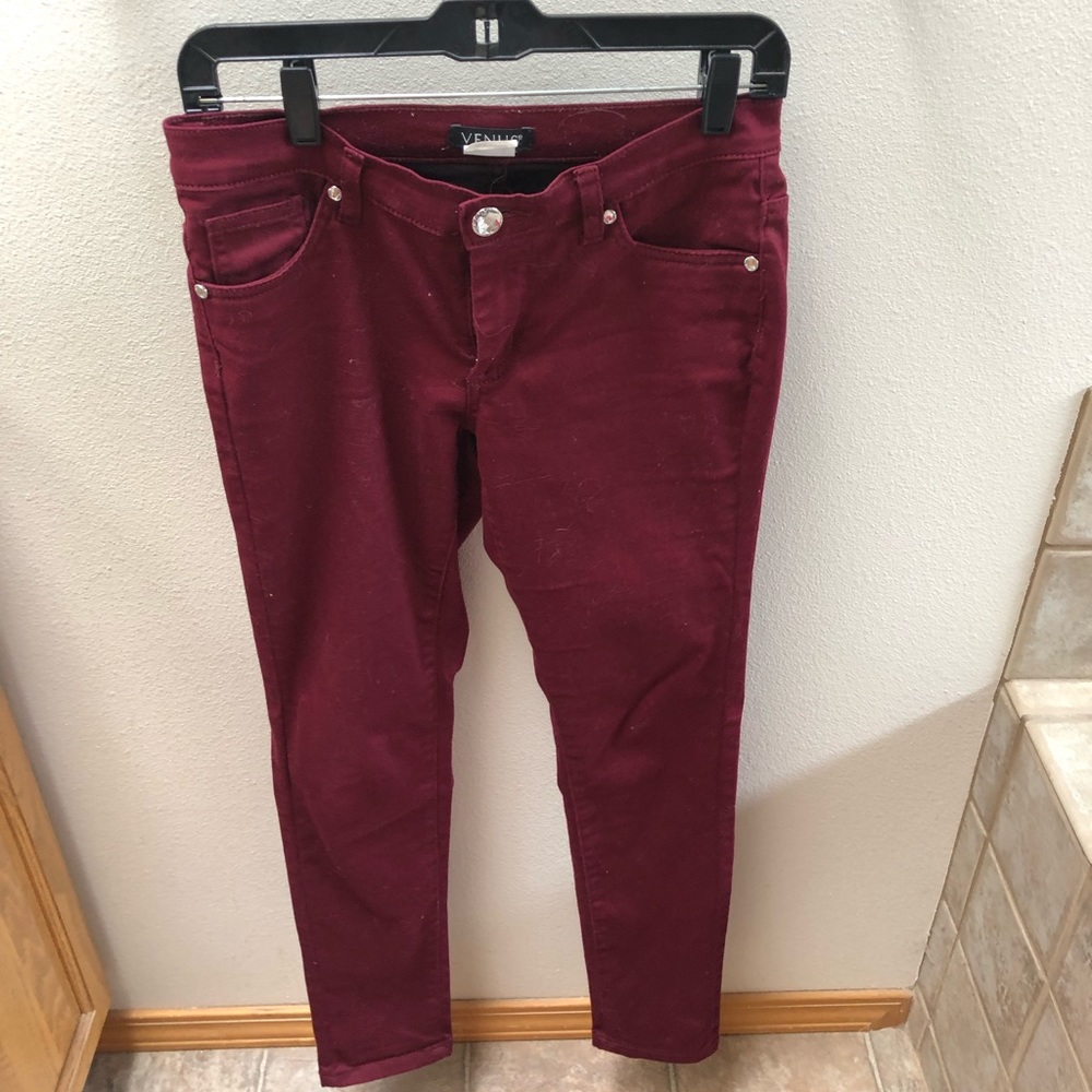 Burgundy colored denim with rhinestone accents